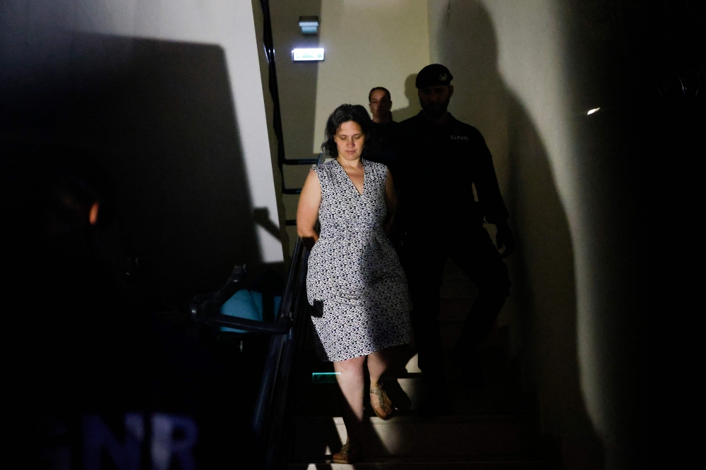 Frenchwoman Marine R. (left) leaves the Setubal courthouse, suspected of abandoning two children, in Setubal, Portugal May 23, 2026. — AFP pic 