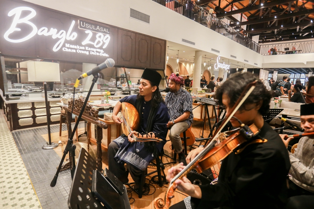 Musicians perform among dining outlets inside the newly renovated Old General Post Office on Jalan Raja, Kuala Lumpur, May 23, 2026. — Picture by Sayuti Zainudin