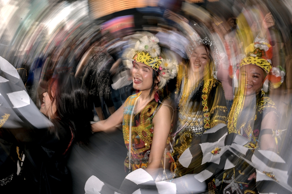 Participants in traditional attire take part in the Borneo Native Festival parade around Bukit Bintang in Kuala Lumpur May 24, 2026, in conjunction with Kaamatan and Gawai celebrations. — Bernama pic