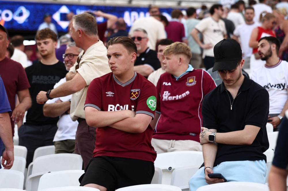 West Ham United’s fans react in the stands after the English Premier League football match between West Ham United and Leeds United at the London Stadium, in east London May 24, 2026. — AFP pic
