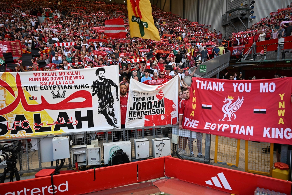Fans hold tributes to Jordan Henderson and Liverpool’s Egyptian striker #11 Mohamed Salah ahead of the English Premier League football match between Liverpool and Brentford at Anfield in Liverpool May 24, 2026. —  AFP pic 