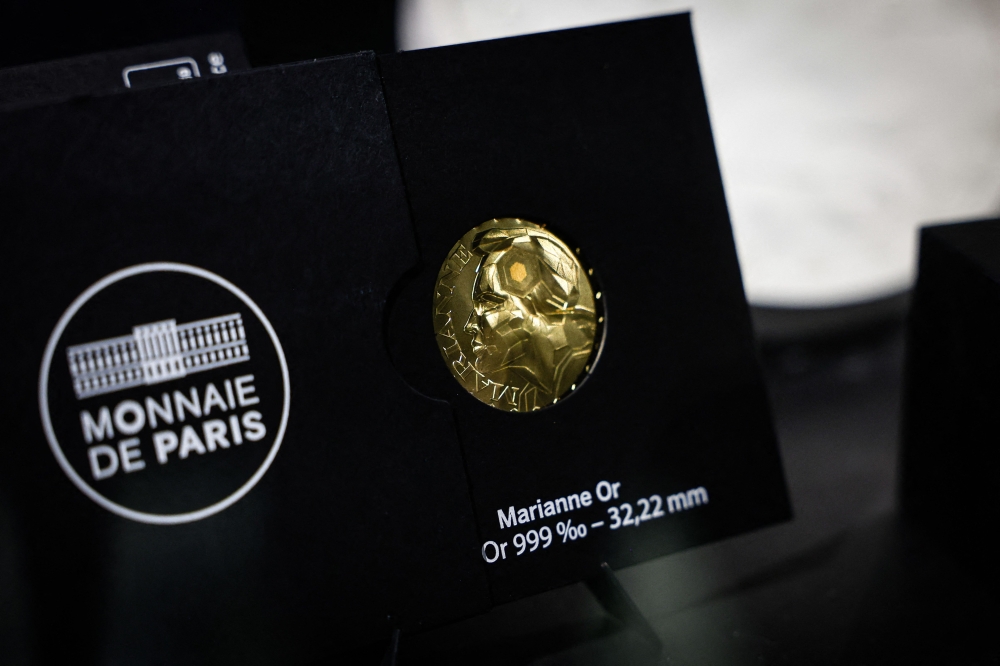A Marianne-Or gold coin bullion is displayed at La Monnaie de Paris in Paris on May 21, 2026. — AFP pic