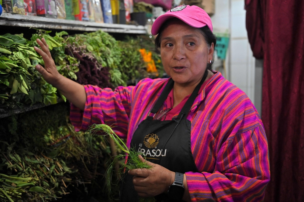 Ecuadorean curandera Amparo Lugmana, a performer of energy cleansing on pets, speaks with AFP at the San Francisco market in Quito on May 17, 2026. — AFP pic