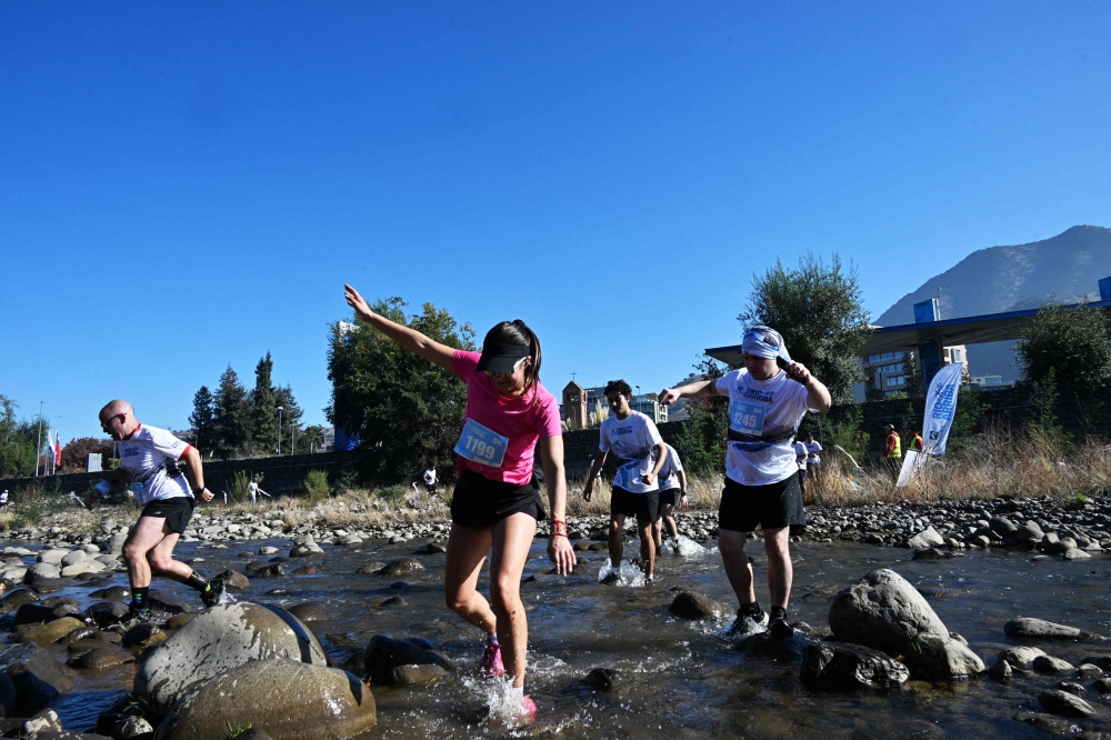 Runners take part in a race along the banks of the Mapocho River in Santiago on May 17, 2026 — AFP pic