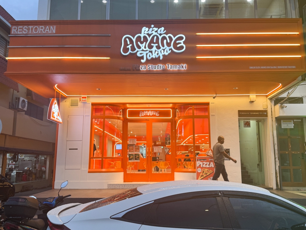 Look for that bright orange facade that will grab your eyes for super large pizza slices. 