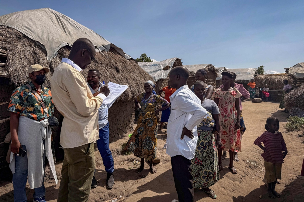 Dr. Blaise Mugisa registers people who have been in contact with a person suspected of having died from Ebola at a camp for displaced persons in Rwampara, Ituri, in the eastern Democratic Republic of the Congo, on May 26, 2026. — AFP pic
