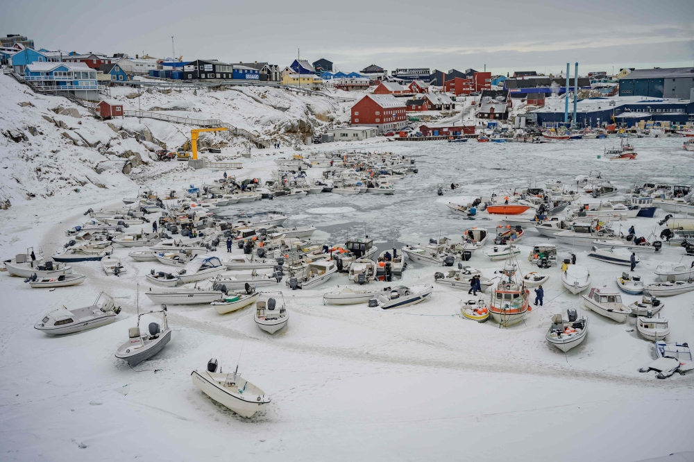 This photograph shows the snow-covered harbour, where many fishermen from the Philippines work, in Ilulissat, Greenland, on March 18, 2026. — AFP pic