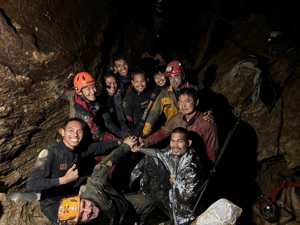 Rescuers pose for a photo as they work to save trapped people in a cave in Xaisomboun Province, Laos, May 29, 2026. — Reuters picc