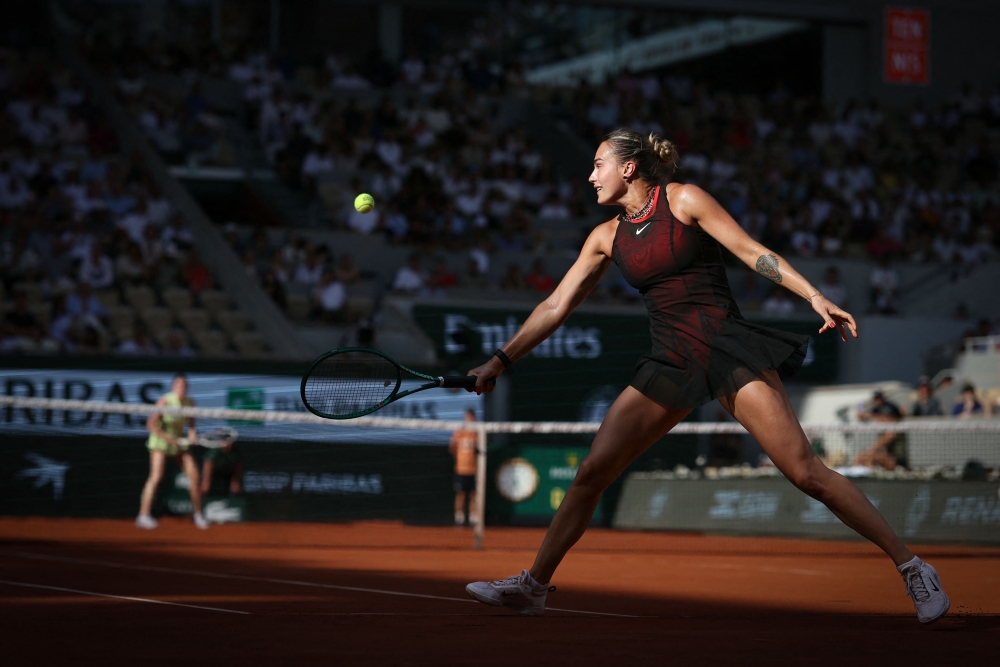 Aryna Sabalenka in a lightweight black dress accented with sparkling necklaces. — AFP pic