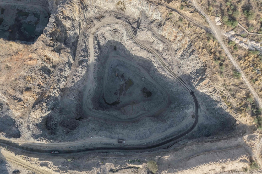 This aerial photograph taken on May 19, 2026 shows an open-cast stone quarry in the Aravalli mountain range in Rajasthan’s Neem ka Thana town. Dizzyingly deep pits from large-scale mining scar India’s ancient Aravalli mountains, threatening the future of a forested buffer that New Delhi relies on for protection from furnace-hot desert winds. — AFP pic 