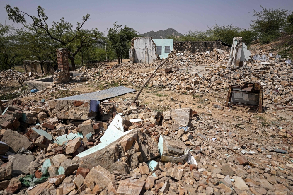This photograph taken on May 18, 2026 shows rubble scattered around abandoned houses in Chatru ki Dhani village in Rajasthan’s Neem ka Thana town. — AFP pic