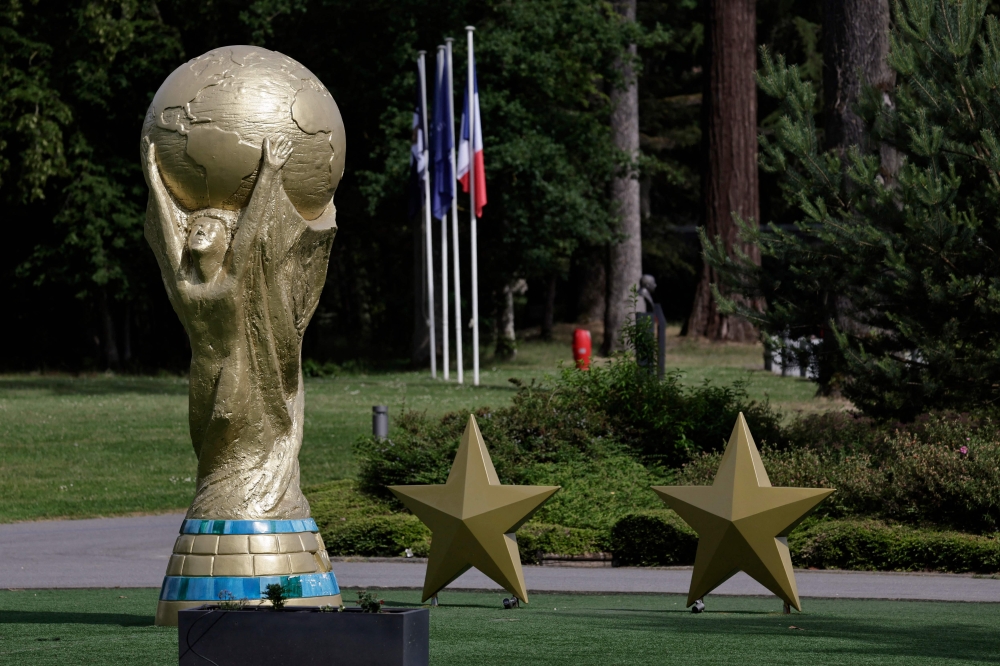 A replica of the Fifa World Cup Trophy stands at the entrance to the French football federation’s Clairefontaine training base, southwest of Paris. — AFP pic