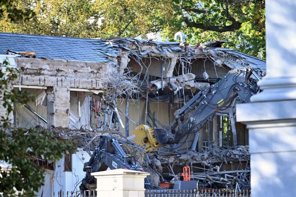 Heavy machinery tears down a section of the East Wing of the White House as construction begins on President Donald Trump’s planned ballroom, in Washington, DC October 20, 2025. — AFP pic