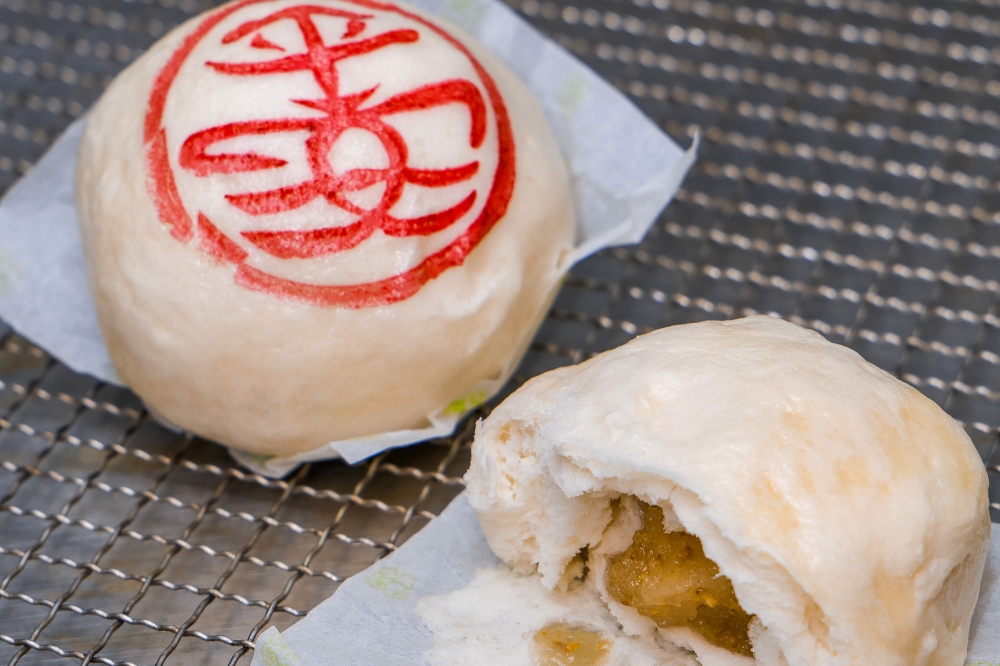 A bun stamped with the Chinese characters for peace and pronounced as ‘Ping On’ in Cantonese, and its traditional white sesame filling. In the past, it was stamped with the Chinese character 寿 pronounced in Cantonese as ‘Sau’ (longevity). — Picture courtesy of Hong Kong Tourism Board.