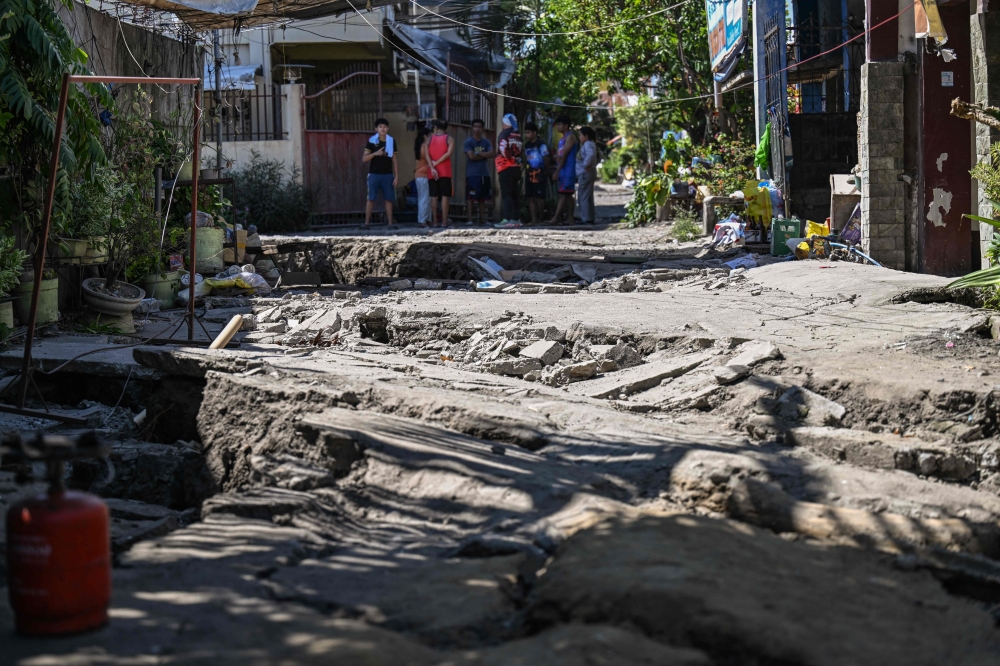 This photo shows a damaged road after a 7.8 magnitude earthquake in General Santos City on June 9, 2026. — AFP pic 