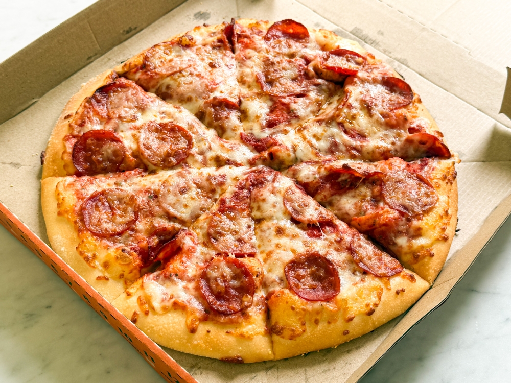 Nothing beats the Classic Pepperoni Pizza with its spicy salami using beef and cheese. — Picture by Lee Khang Yi