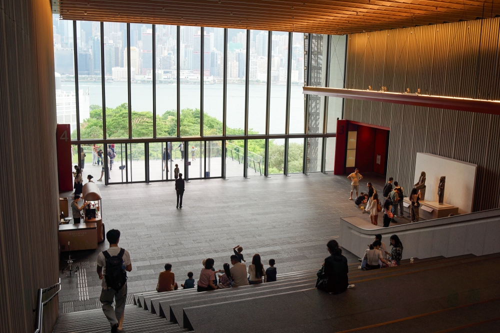 The atrium stairway at Hong Kong Palace Museum offers views of the harbour and the city’s skyline. — Picture by Ida Lim