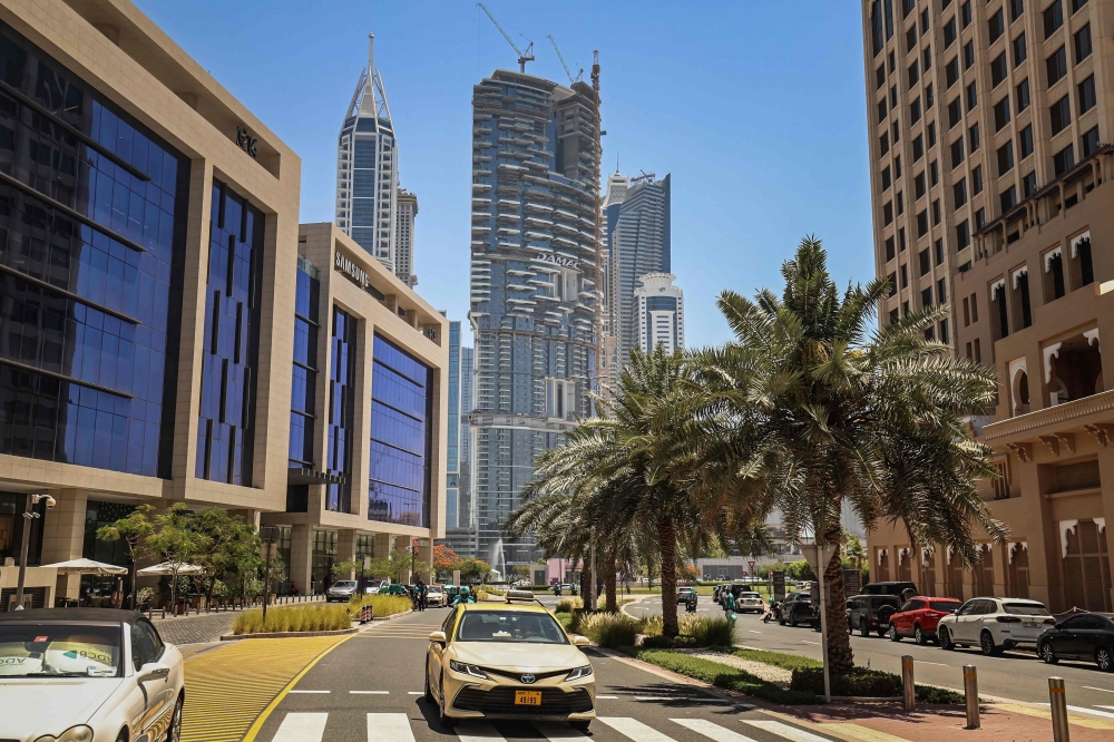 A building belonging to DAMAC, a Dubai-based luxury real estate developer founded in 2002 by businessman Hussain Sajwani, is seen in the background in Dubai on June 4, 2026. The UAE real estate magnate close to Donald Trump is pumping billions of dollars into data centres, hoping to cash in on the AI boom and become the global leader in the field. — AFP pic 