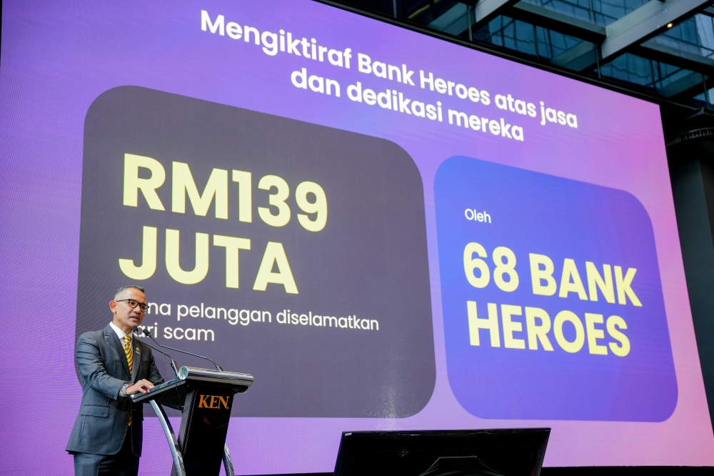 National Taskforce to Combat Fraud chairman Syed Ahmad Taufik Albar speaks at the #JanganKenaScam Bank Heroes Recognition Event 2026 in Petaling Jaya. — Picture courtesy of ABM