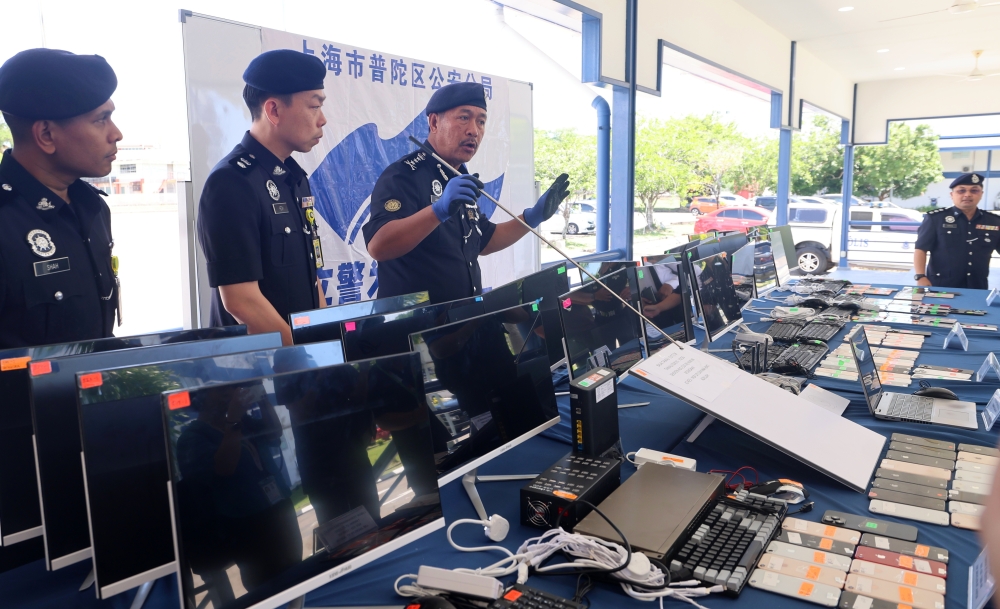 Sabah police bust 12 scam call centres, arrest 341 suspects