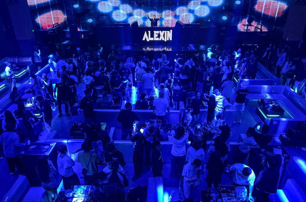 Young Yangon revellers chase joy in sweaty clubs, wary of streets haunted by post‑coup danger