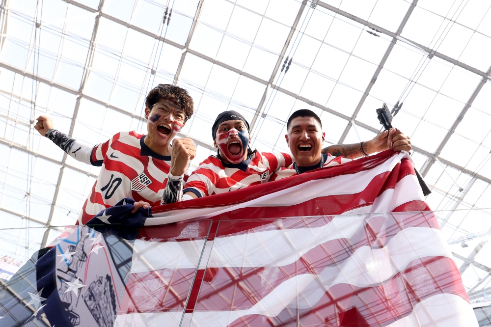 United States fans pose for a photograph before the FIFA World Cup 2026 Group D match between USA and Paraguay at Los Angeles Stadium on June 12, 2026 in Los Angeles, California. — Getty Images via AFP