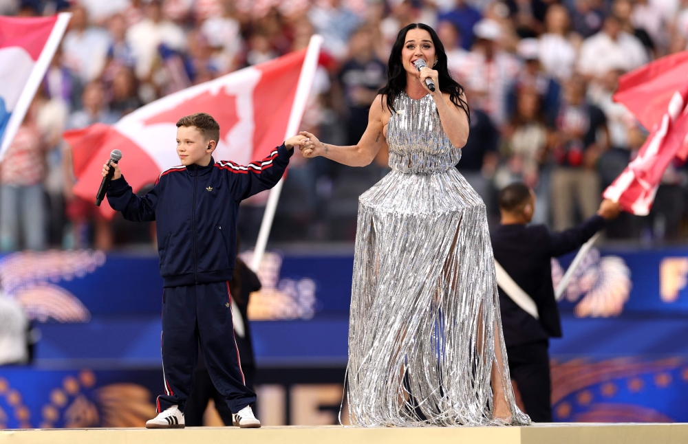 An astronaut, movie stars and a knight: Cruise, DiCaprio and Beckham pack the stands as Katy Perry, Lisa perform at LA World Cup opener