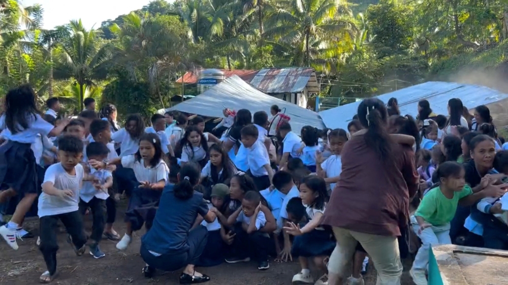 Children react as the roof of a structure at Deped Mahayahay Elementary School collapses during an earthquake in Digos, Mindanao Island, Philippines, June 8, 2026. — Screengrab from handout video by Deped Mahayahay Elementary via AFP