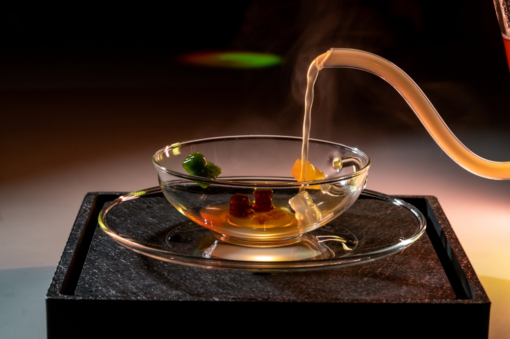 In reality the gummies are served in a bowl with that hot broth poured over it to melt. — Picture courtesy of Ultraviolet
