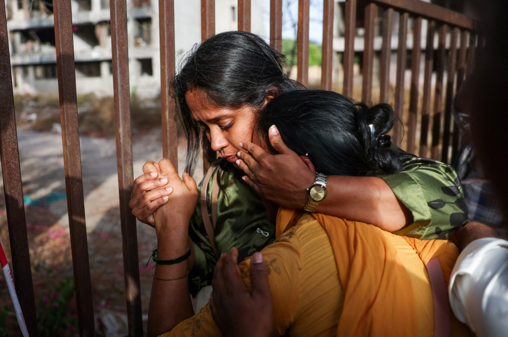 Family members react as they gather near the crash site during the first anniversary of the Air India Boeing 787-8 Dreamliner crash in Ahmedabad, India, June 12, 2026. — Reuters pic 