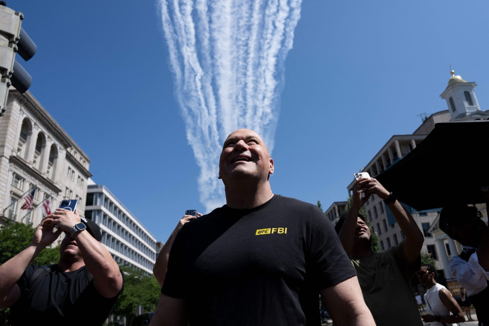 Dana White, president and chief executive officer of Ultimate Fighting Championship, watches as United States military jets perform a practice flyover before the UFC Freedom 250 event at the White House in Washington, D.C. on June 12, 2026. — AFP pic