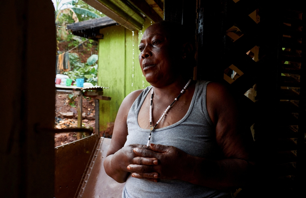Bertha Aleko, mother to the late Congolese Pastor Paluku known as ;Jeune Patron;, whom local authorities believe could be one of the first victims of a new Ebola outbreak involving the Bundibugyo strain outbreak and died on February 3, 2026, poses inside her house in Quartier Shuni 1, a residential sector, in Mongbwalu, Djugu Territory of Ituri province, Democratic Republic of the Congo, June 4, 2026. — Reuters pic