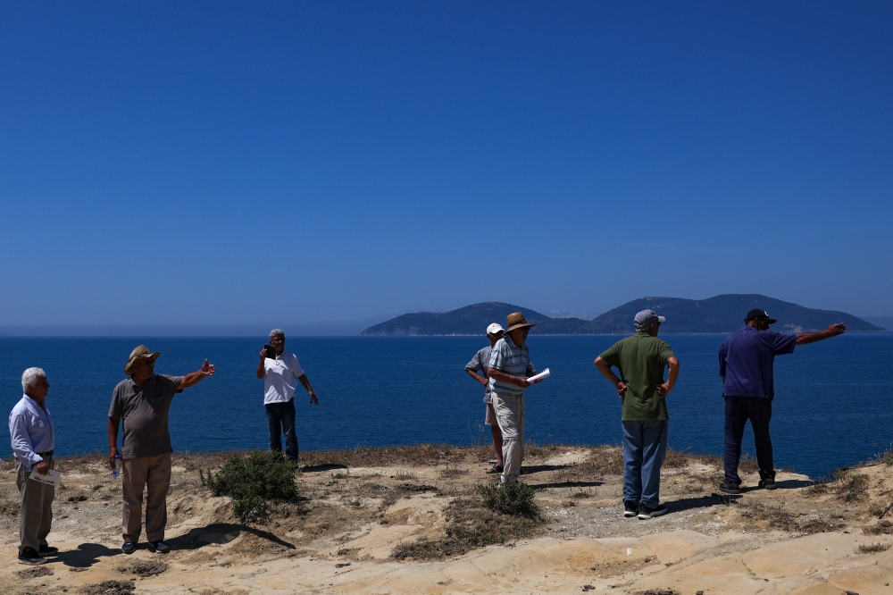 Locals who claim to own the land where a luxury resort is planned by a company linked to Donald Trump’s son-in-law, Jared Kushner stand at the bay of the Vjosa-Narta Protected Area, in Zvernec near Vlora, Albania June 10, 2026. — Reuters pic  