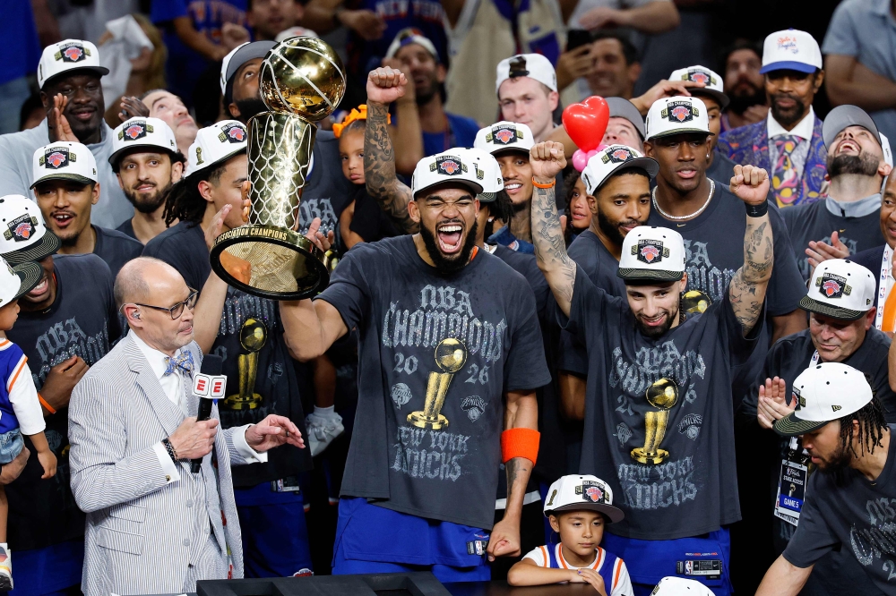 Karl-Anthony Towns of the New York Knicks celebrates with the Larry O’Brien Championship Trophy after defeating the San Antonio Spurs in game five of the 2026 NBA Finals at the Frost Bank Center in San Antonio, Texas on June 13, 2026. — AFP pic