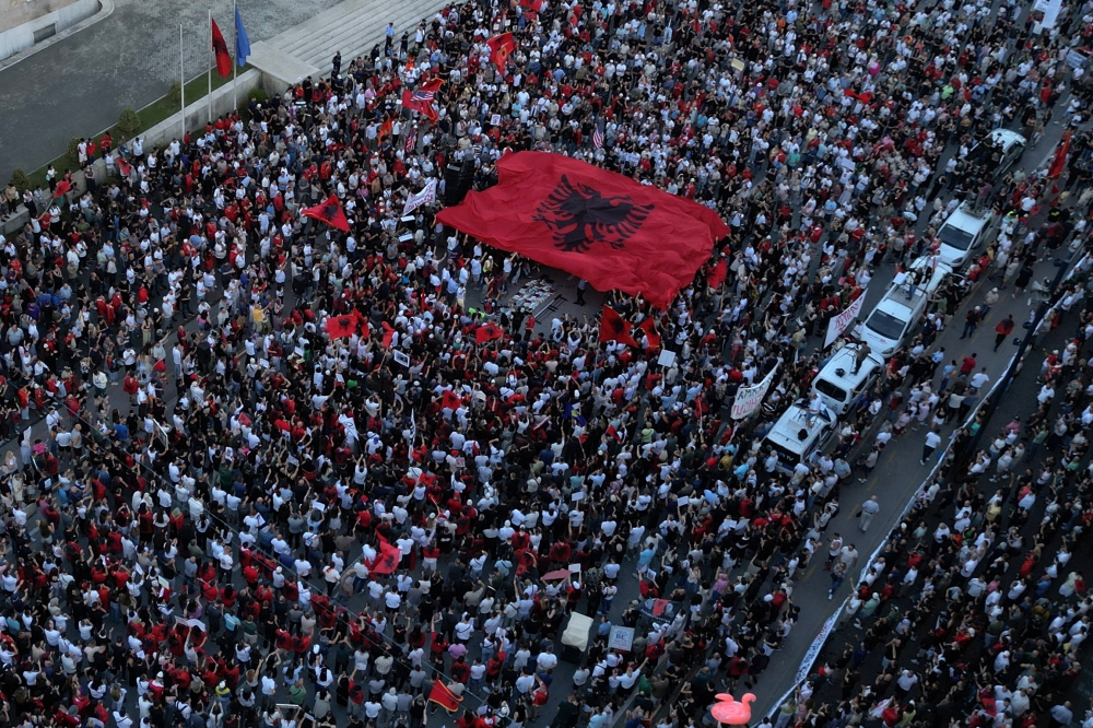 A drone view shows protesters holding a large Albanian national flag during a protest against a luxury resort, a plan by a company linked to Donald Trump’s son-in-law, Jared Kushner, on an environmentally sensitive part of the Adriatic coast, in Tirana, Albania June 13, 2026. — Reuters pic