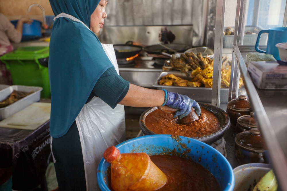 Ayam penyet Mak Maya, Kampung Baru, is one of the more affordable ‘ayam penyet’ stalls, a full meal costs RM12. — Picture by Raymond Manuel