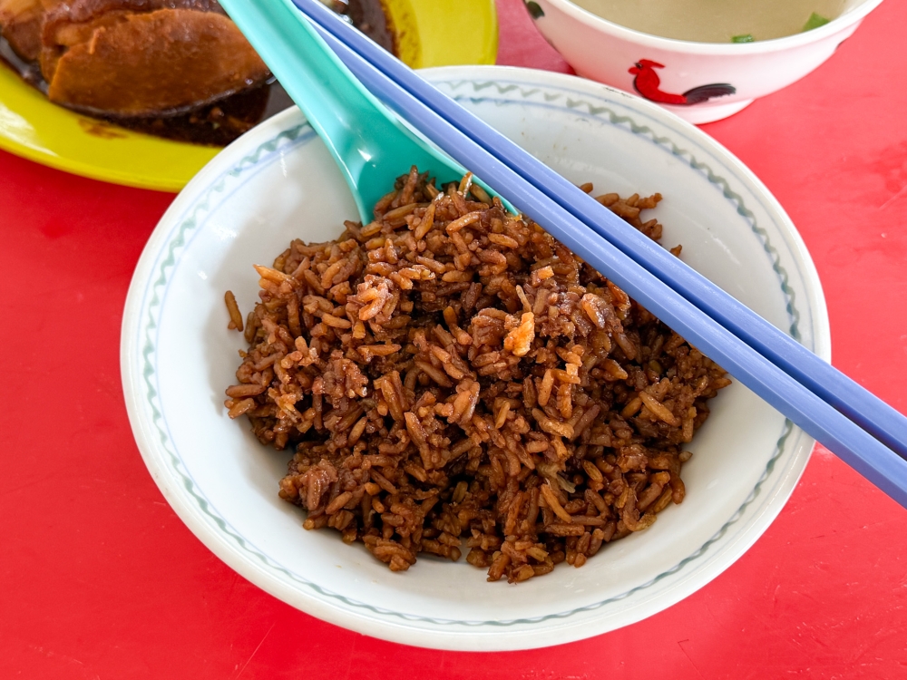 A bowl of Yam Rice here isn't loaded with yam pieces but each grain is infused with dried prawns — Picture by Lee Khang Yi