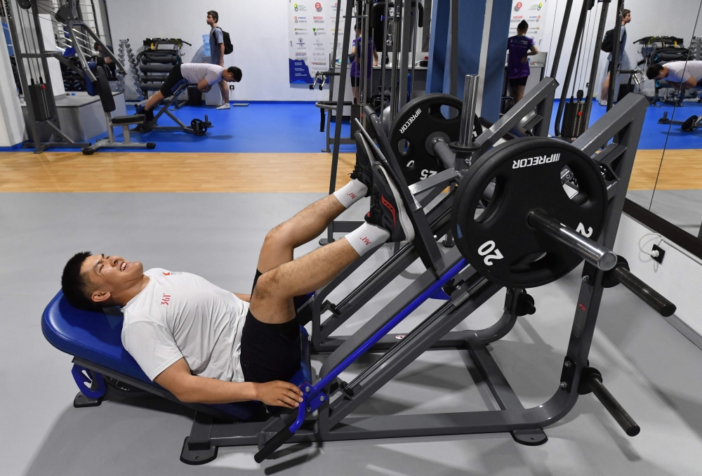 Aizaratbek Esenov exercises in a gym at the Triathlon Centre in Bishkek April 29, 2026. Esenov and other civil servants star in a government-sponsored show which should prepare them to compete in the amateur Asia Triathlon Cup this autumn, while helping promote a healthy lifestyle and fight obesity among the population. — AFP pic 
