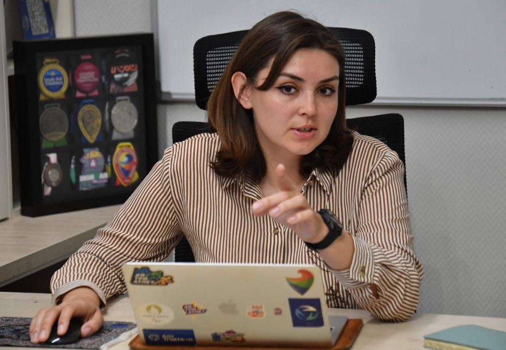 Elena Lyzhina-Polchenkova, head of the Kyrgyz Triathlon Federation, talks to AFP reporters in Bishkek on April 30, 2026. — AFP pic 