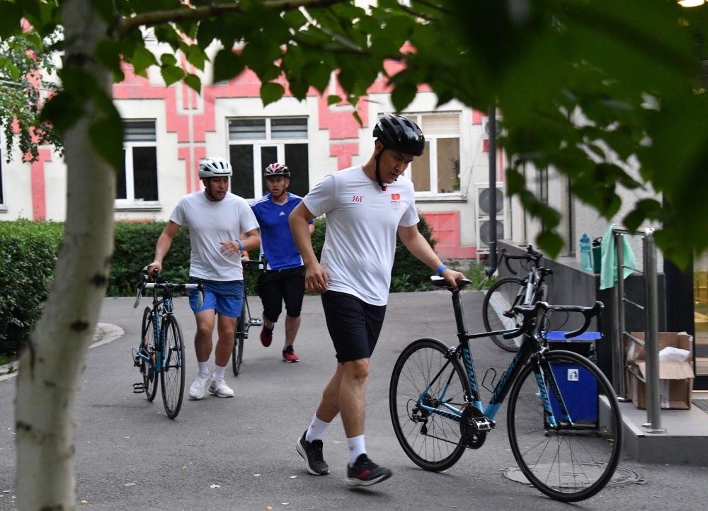Civil servants train for triathlon on TV as Kyrgyzstan turns to reality shows to fight obesity