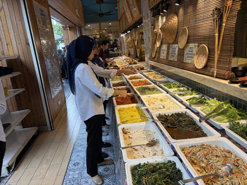 The array of dishes at Syazana Nasi Melayu. — Picture by Opalyn Mok