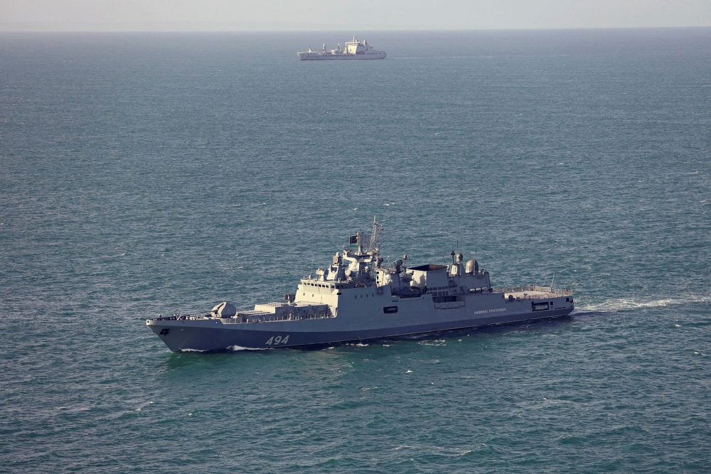 Russian warship fires ‘warning shots’ at UK yacht in Channel standoff