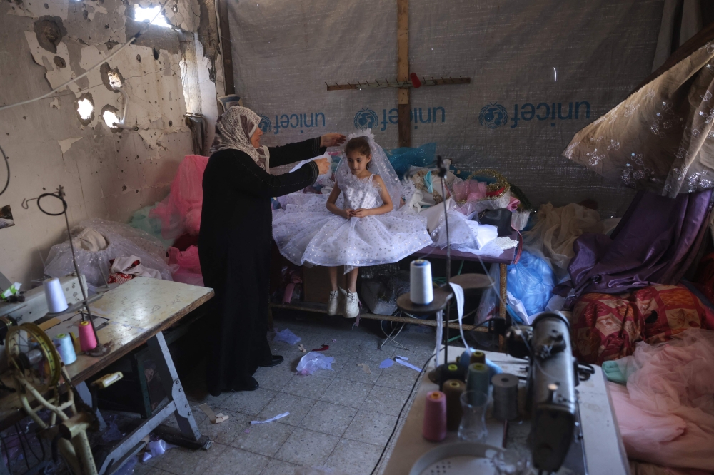 Hope in a dress: Recycled gowns bring moments of escape in Gaza