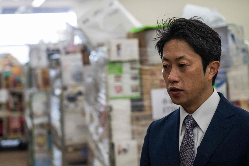 Ippei Kobayashi, president and representative director of Hamaya second-hand wholesale auction company, looks on during an interview with AFP in Higashimatsuyama, Saitama Prefecture. — AFP pic