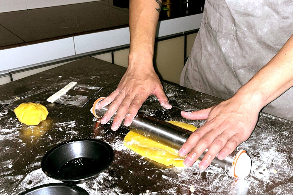 Rolling pastry for the meat pies. — Picture courtesy of Haus of Pie