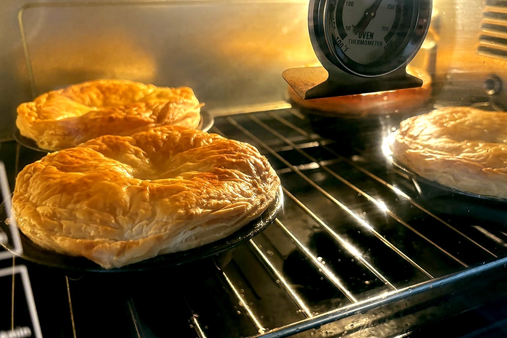 Baking the pies in the oven. — Picture courtesy of Haus of Pie