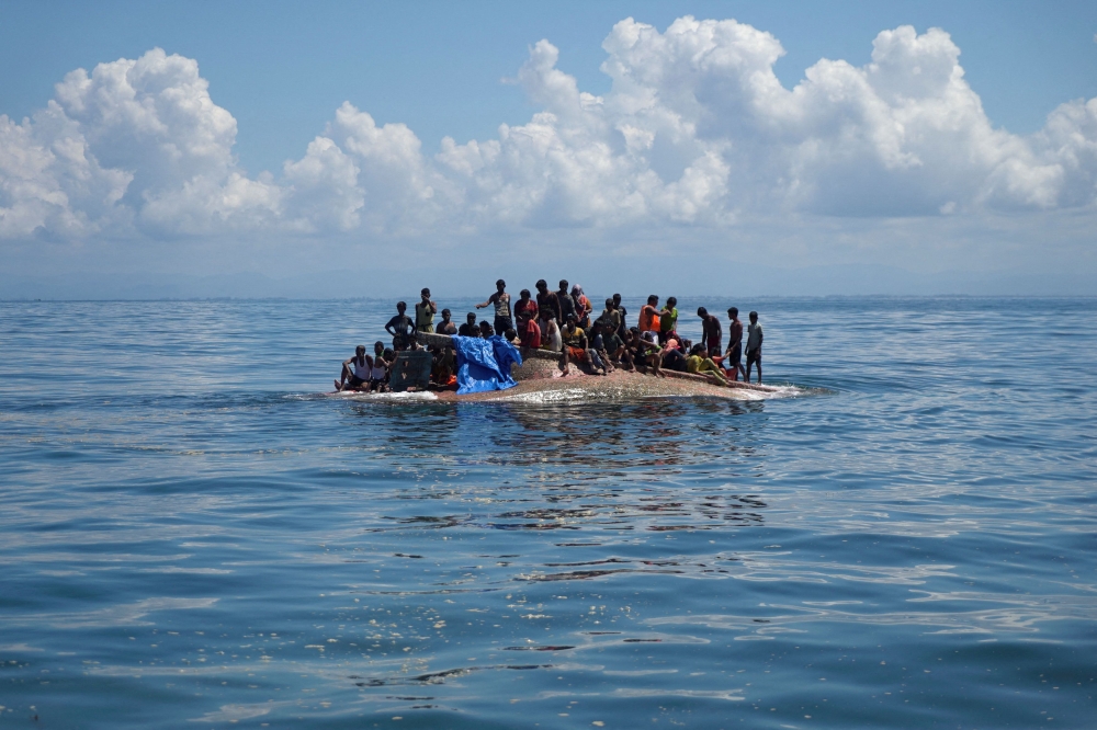 File picture of Rohingya refugees on a capsized boat before being rescued in the waters of West Aceh, Indonesia, March 21, 2024. — Reuters pic 