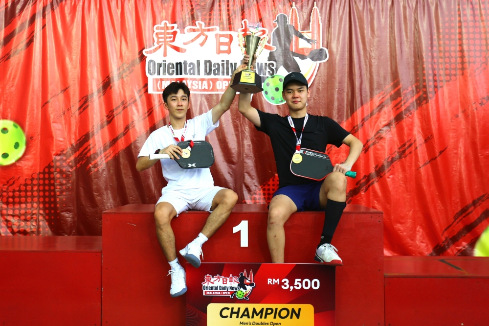Champions of the Men’s Doubles Open category, one of the tournament’s most competitive categories, Dickson Ng (left) and Desmond Lim. — Picture courtesy of ODN Malaysia Open