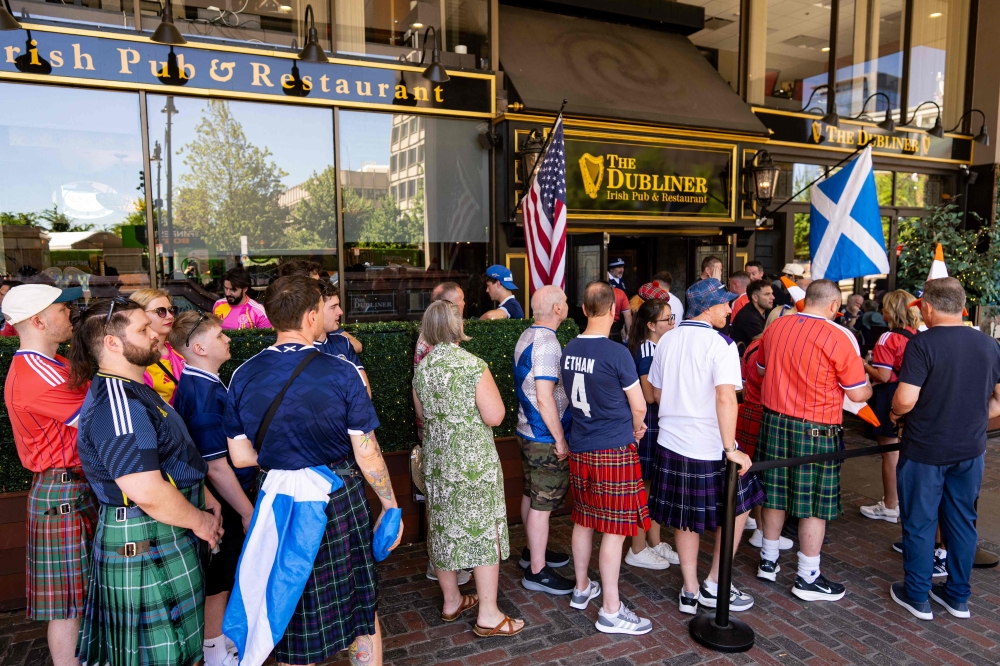 Scotland fans wear jerseys as they wait outside The Dubliner bar before a Fifa World Cup watch party on June 13, 2026 in Boston, Massachusetts. — Mel Musto/Getty Images North America/Getty Images pic via AFP