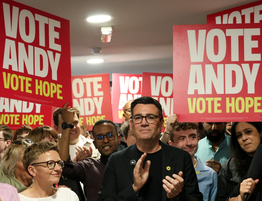 Greater Manchester mayor and Labour candidate Andy Burnham applauds on the day he delivers a speech on apprenticeships, ahead of the June 18 Makerfield by-election, in Wigan June 13, 2026. — Reuters pic